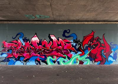 Red and Colorful Stylewriting by omseg and Kosem. This Graffiti is located in Freiburg, Germany and was created in 2023. This Graffiti can be described as Stylewriting, Characters and Wall of Fame.