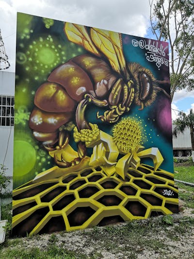 Yellow Characters by Dutek pacheco. This Graffiti is located in Tulum, Mexico and was created in 2021.