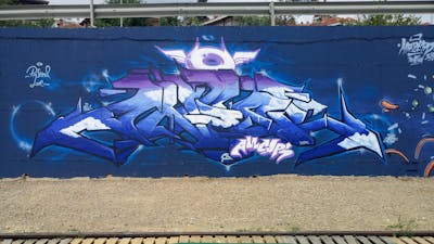 Blue and White Stylewriting by DCK, Angel and ALL CAPS COLLECTIVE. This Graffiti is located in Hungary and was created in 2019. This Graffiti can be described as Stylewriting and Wall of Fame.