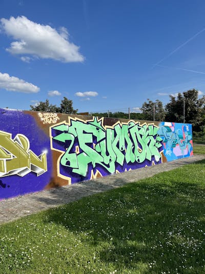 Light Green and Colorful Stylewriting by Fumok. This Graffiti is located in Oschatz, Germany and was created in 2022. This Graffiti can be described as Stylewriting and Wall of Fame.