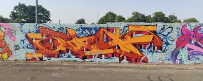 Orange and Red Stylewriting by Skaf. This Graffiti is located in Magdeburg, Germany and was created in 2022. This Graffiti can be described as Stylewriting and Wall of Fame.