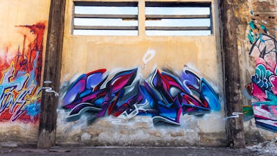 Blue and Violet Stylewriting by SNUZ. This Graffiti is located in Thessaloniki, Greece and was created in 2022. This Graffiti can be described as Stylewriting, Abandoned and Futuristic.