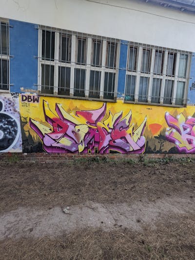 Yellow and Violet and Coralle Stylewriting by Dosec and ATK. This Graffiti is located in Rosswein, Germany and was created in 2024.