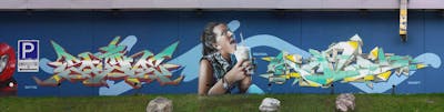 Light Blue and Colorful Stylewriting by Searok, Randy and Sayne One. This Graffiti is located in Salzburg, Austria and was created in 2022. This Graffiti can be described as Stylewriting, Characters and Streetart.