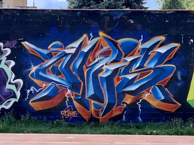 Blue and Orange Stylewriting by Czosen1. This Graffiti is located in Warsaw, Poland and was created in 2022. This Graffiti can be described as Stylewriting and Wall of Fame.