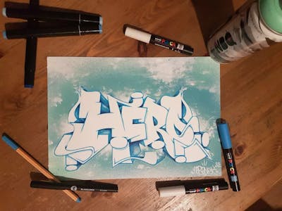 White and Light Blue and Cyan Blackbook by Hero. This Graffiti is located in Germany and was created in 2023.