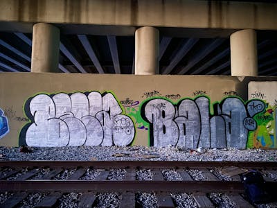 Chrome Throw Up by BALA, Beca and Tko. This Graffiti is located in Tulsa, United States and was created in 2024. This Graffiti can be described as Throw Up and Line Bombing.