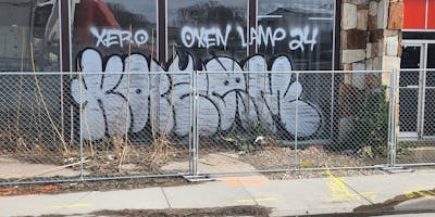 Chrome Throw Up by Kazem. This Graffiti is located in United States and was created in 2024. This Graffiti can be described as Throw Up, Abandoned and Street Bombing.