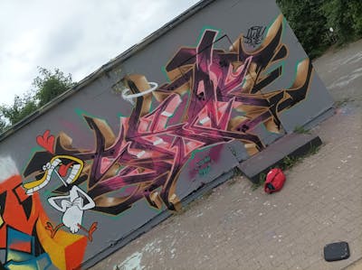 Coralle and Brown Stylewriting by Skaf, ATC and ONB. This Graffiti is located in Leipzig, Germany and was created in 2022. This Graffiti can be described as Stylewriting, Characters and Wall of Fame.