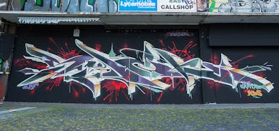 Grey and Coralle and Beige Stylewriting by Syck, ABS, KKP and Los Capitanos. This Graffiti is located in mönchengladbach, Germany and was created in 2023.