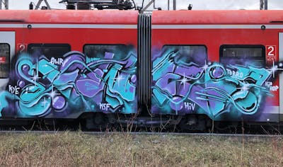Violet and Cyan Stylewriting by KWER. This Graffiti is located in Germany and was created in 2024. This Graffiti can be described as Stylewriting and Trains.