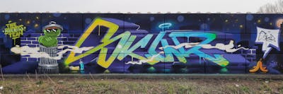 Violet and Colorful and Light Blue Stylewriting by the Buddys and Skur.ill. This Graffiti is located in Germany and was created in 2024. This Graffiti can be described as Stylewriting, Characters, Streetart and Wall of Fame.