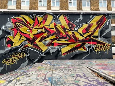 Yellow and Red and Black Stylewriting by Chips. This Graffiti is located in London, United Kingdom and was created in 2022. This Graffiti can be described as Stylewriting and Wall of Fame.