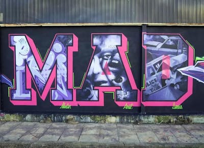 Coralle and Violet Stylewriting by APSET, DEM and Merlin. This Graffiti is located in Thessaloniki, Greece and was created in 2021. This Graffiti can be described as Stylewriting, Characters and Wall of Fame.