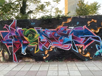 Colorful Stylewriting by Heny and Alfa crew. This Graffiti is located in Thessaloniki, Greece and was created in 2022. This Graffiti can be described as Stylewriting and Wall of Fame.