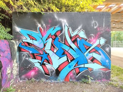 Red and Light Blue Stylewriting by Deno. This Graffiti is located in Lovran, Croatia and was created in 2023.