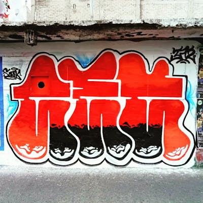 Red and White Stylewriting by Aek. This Graffiti is located in Acapulco, Mexico and was created in 2022. This Graffiti can be described as Stylewriting, Street Bombing and Throw Up.
