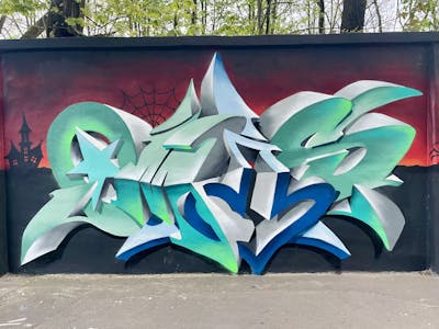 Cyan and Colorful Stylewriting by OMIS and Czosen1. This Graffiti is located in Warsaw, Poland and was created in 2024. This Graffiti can be described as Stylewriting and 3D.