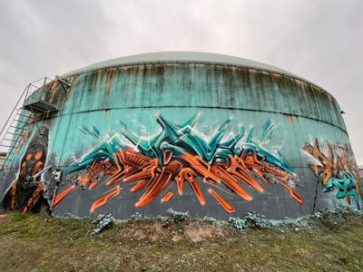 Cyan and Orange Stylewriting by angst. This Graffiti is located in Germany and was created in 2023. This Graffiti can be described as Stylewriting, Characters, 3D and Atmosphere.