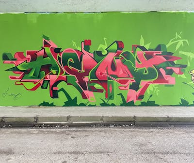 Green and Coralle Stylewriting by Heny - Alfa crew and Heny. This Graffiti is located in Lier, Belgium and was created in 2022.