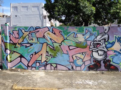 Colorful Stylewriting by bez and ADM. This Graffiti is located in San Juan, Puerto Rico and was created in 2011. This Graffiti can be described as Stylewriting and Characters.