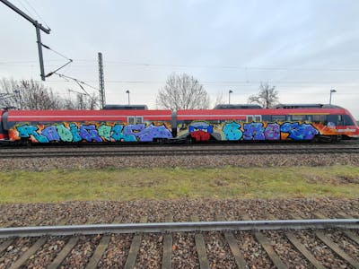 Colorful Stylewriting by bros, RADICALS, RCS, rizok and R120K. This Graffiti is located in Leipzig, Germany and was created in 2021. This Graffiti can be described as Stylewriting, Characters and Trains.