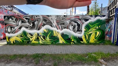 Grey and Light Green and Green Stylewriting by Sainter. This Graffiti is located in Bratislava, Slovakia and was created in 2023. This Graffiti can be described as Stylewriting, 3D and Wall of Fame.