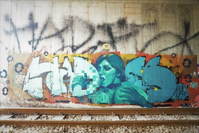 Cyan and Orange Stylewriting by Hades. This Graffiti is located in Sarajevo, Bosnia and Herzegovina and was created in 2018. This Graffiti can be described as Stylewriting, Characters, Streetart and Line Bombing.
