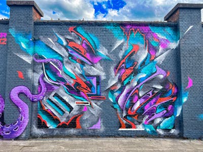 Colorful and Cyan and Red Stylewriting by SNUZ. This Graffiti is located in Antwerp, Belgium and was created in 2023. This Graffiti can be described as Stylewriting, Wall of Fame and Murals.