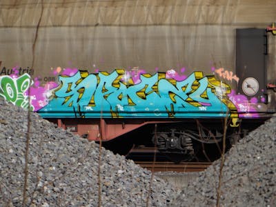 Light Blue and Yellow and Coralle Stylewriting by Spocey. This Graffiti is located in Netherlands and was created in 2022. This Graffiti can be described as Stylewriting, Trains and Freights.
