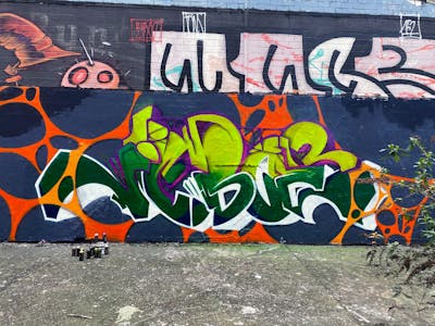 Colorful and Green Stylewriting by Jibo and MDS. This Graffiti is located in Düsseldorf, Germany and was created in 2023. This Graffiti can be described as Stylewriting and Wall of Fame.