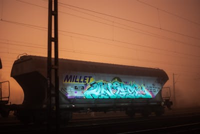 Cyan Stylewriting by DCK, Angel and ALL CAPS COLLECTIVE. This Graffiti is located in Hungary and was created in 2019. This Graffiti can be described as Stylewriting, Trains, Freights and Atmosphere.
