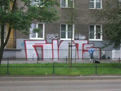 Chrome and Red Street Bombing by Riots. This Graffiti is located in Krakow, Poland and was created in 2009. This Graffiti can be described as Street Bombing and Stylewriting.