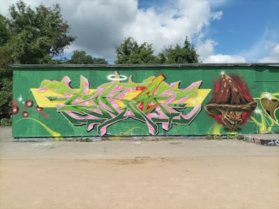 Light Green and Coralle Stylewriting by Skaf, ATC and ONB. This Graffiti is located in Leipzig, Germany and was created in 2022. This Graffiti can be described as Stylewriting, Characters and Wall of Fame.