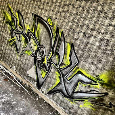 Grey and Yellow Stylewriting by Ketru. This Graffiti is located in France and was created in 2024. This Graffiti can be described as Stylewriting and Abandoned.
