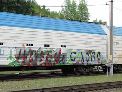 Light Green and Grey and Colorful Stylewriting by SLOVO and TWESO. This Graffiti is located in Moscow, Russian Federation and was created in 2020. This Graffiti can be described as Stylewriting, Freights and Trains.