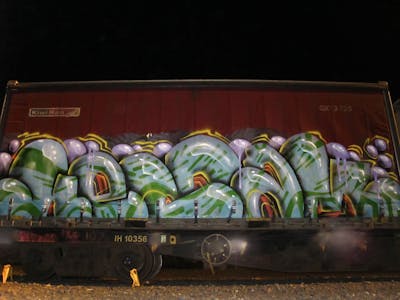 Cyan and Colorful Stylewriting by Kezam. This Graffiti is located in Auckland, New Zealand and was created in 2023. This Graffiti can be described as Stylewriting, Trains, Freights and 3D.