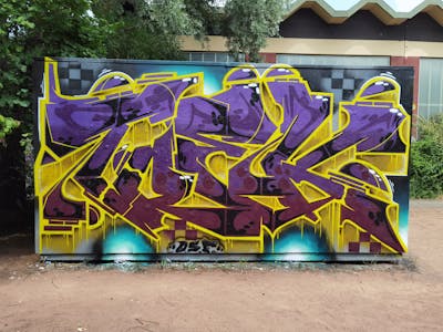 Yellow and Violet Stylewriting by TOEK. This Graffiti is located in Dresden, Germany and was created in 2022. This Graffiti can be described as Stylewriting and Wall of Fame.