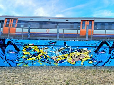 Light Blue and Yellow Stylewriting by SIDOK and Tamoonz. This Graffiti is located in London, United Kingdom and was created in 2022. This Graffiti can be described as Stylewriting, Characters and Wall of Fame.