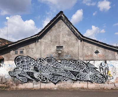 Grey Stylewriting by Reel. This Graffiti is located in Yogyakarta, Indonesia and was created in 2021. This Graffiti can be described as Stylewriting and Abandoned.