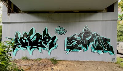 Cyan and Black and Grey Stylewriting by Nesyr and Sirom. This Graffiti is located in Kuala Lumpur, Malaysia and was created in 2022. This Graffiti can be described as Stylewriting.