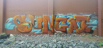 Orange and Light Blue Stylewriting by Sungai. This Graffiti is located in United States and was created in 2022. This Graffiti can be described as Stylewriting and Abandoned.