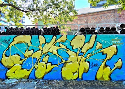 Light Blue and Yellow Stylewriting by SIDOK. This Graffiti is located in Budapest, Hungary and was created in 2022. This Graffiti can be described as Stylewriting and Wall of Fame.