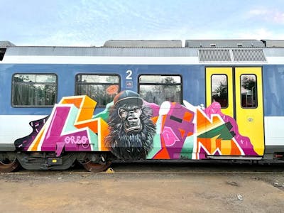 Colorful Trains by Liam and Mister Oreo. This Graffiti is located in Switzerland and was created in 2021. This Graffiti can be described as Trains, Characters, Stylewriting and Special.