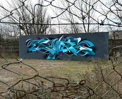 Light Blue and Grey Stylewriting by Coke. This Graffiti is located in Budapest, Hungary and was created in 2022.