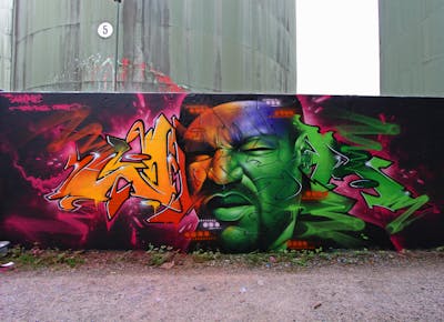 Green and Orange and Colorful Characters by Whyre87, Posk crew and KAC crew. This Graffiti is located in Bern, Switzerland and was created in 2020. This Graffiti can be described as Characters, Stylewriting and Wall of Fame.