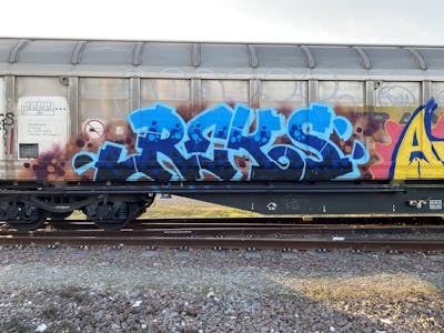 Blue and Light Blue Stylewriting by REKS. This Graffiti is located in Italy and was created in 2024. This Graffiti can be described as Stylewriting, Freights and Trains.
