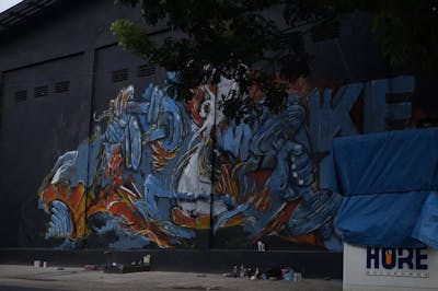Light Blue and Red Characters by Tompo. This Graffiti is located in Bantaeng, Indonesia and was created in 2022. This Graffiti can be described as Characters, Murals and Streetart.