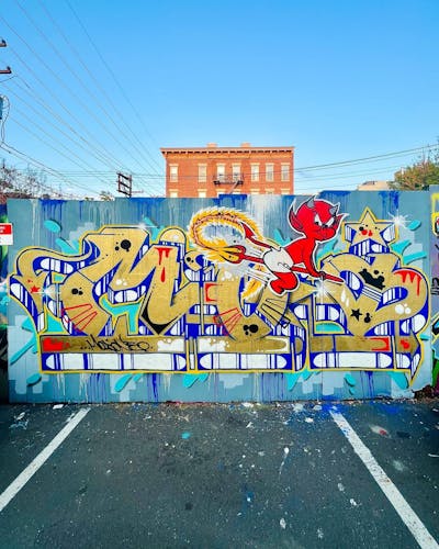 Gold and Colorful Stylewriting by MOI. This Graffiti is located in Jersey City, United States and was created in 2023. This Graffiti can be described as Stylewriting and Characters.