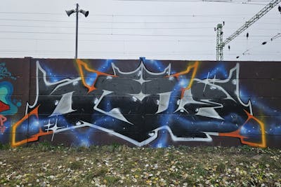 Grey and Orange and Light Blue Stylewriting by OgreOne. This Graffiti is located in Budapest, Hungary and was created in 2023.
